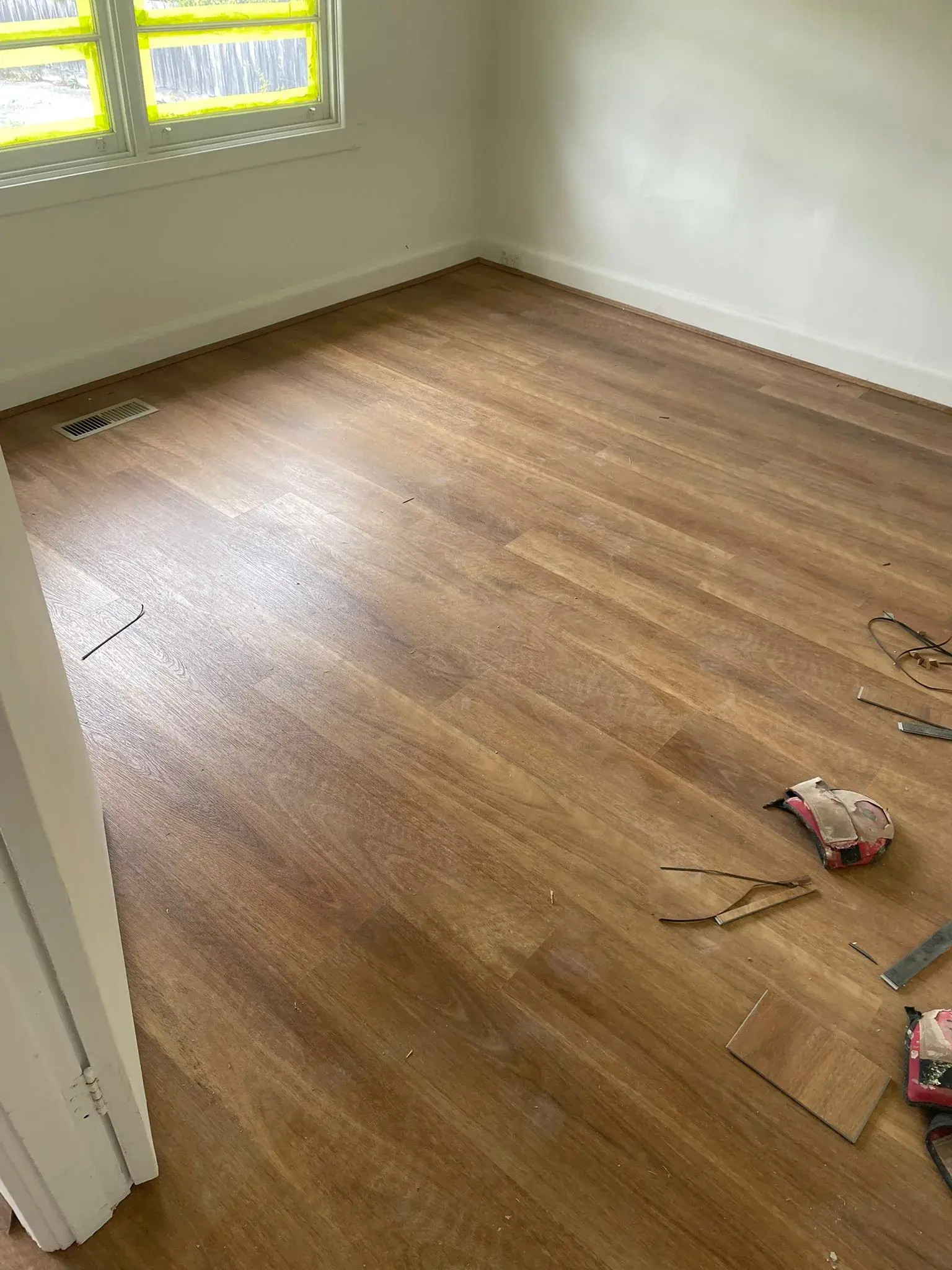 Spotted Gum hybrid flooring installation in a Melbourne home