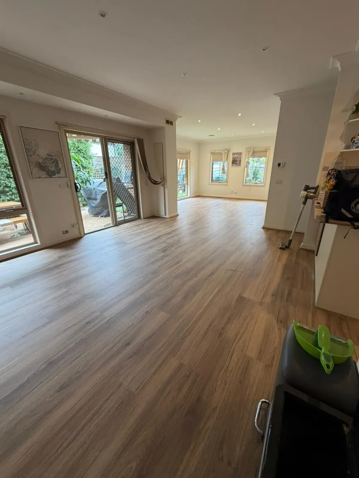 Seamless hybrid flooring across a contemporary dining area